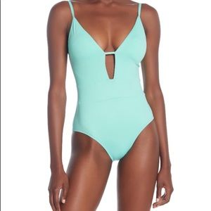 BECCA plunge 1 piece swimsuit. NWT.